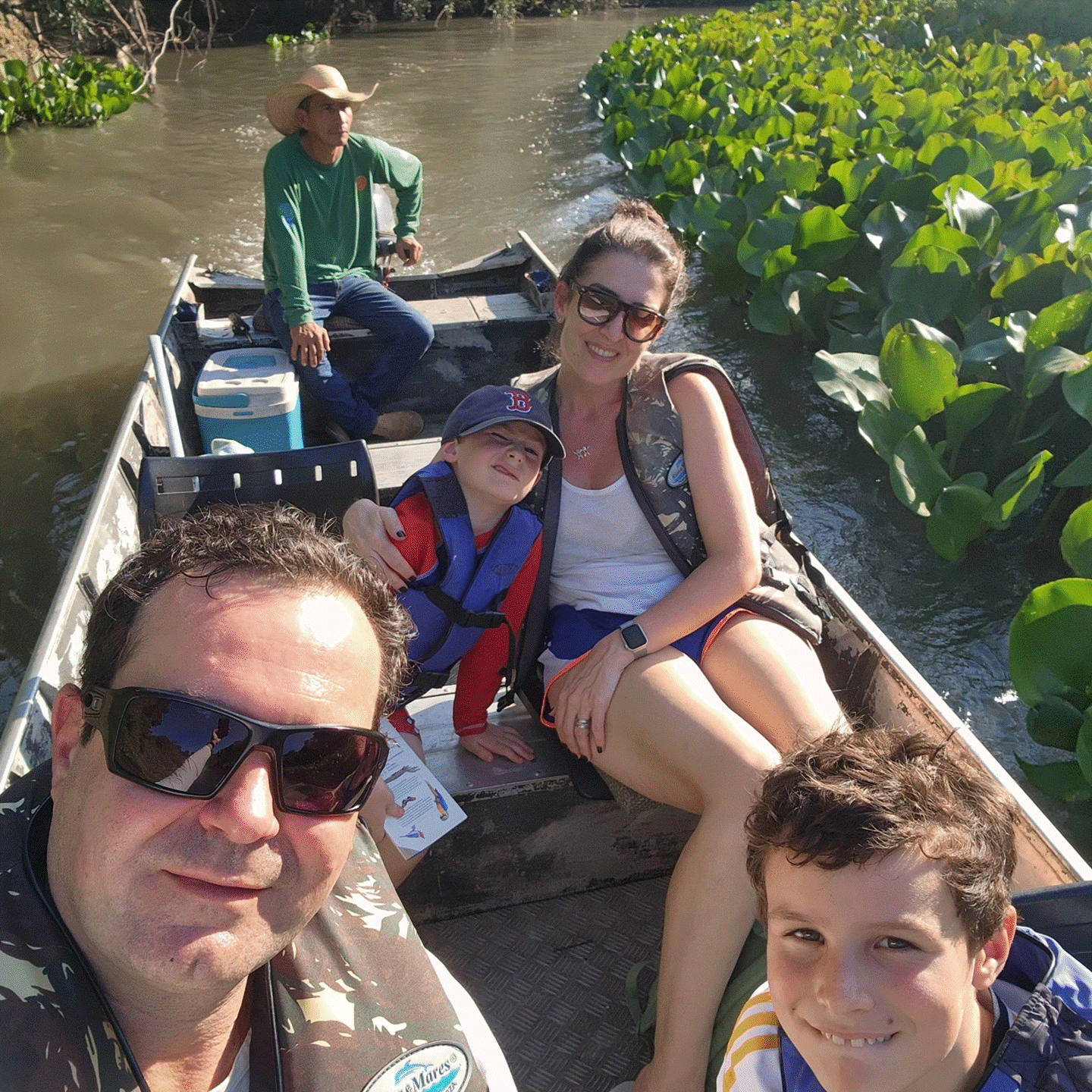 May be an image of 4 people and boat